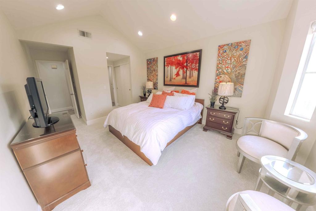 767 Brookstone Road, Unit 301 Chula Vista, CA 91913 - Photo 16 of 28 a bedroom with a bed couch and a dresser