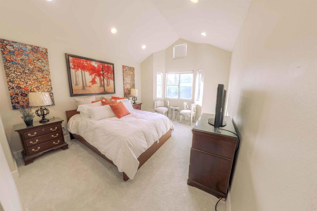 767 Brookstone Road, Unit 301 Chula Vista, CA 91913 - Photo 17 of 28 a bedroom with a bed and furniture