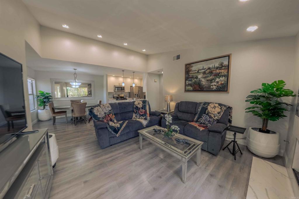 767 Brookstone Road, Unit 301 Chula Vista, CA 91913 - Photo 24 of 28 a living room with furniture potted plant and a flat screen tv