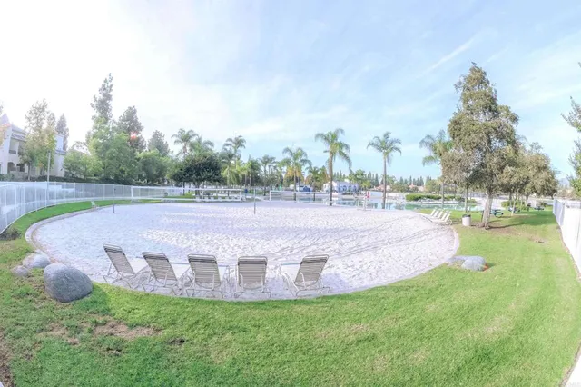 a view of a swimming pool with a yard