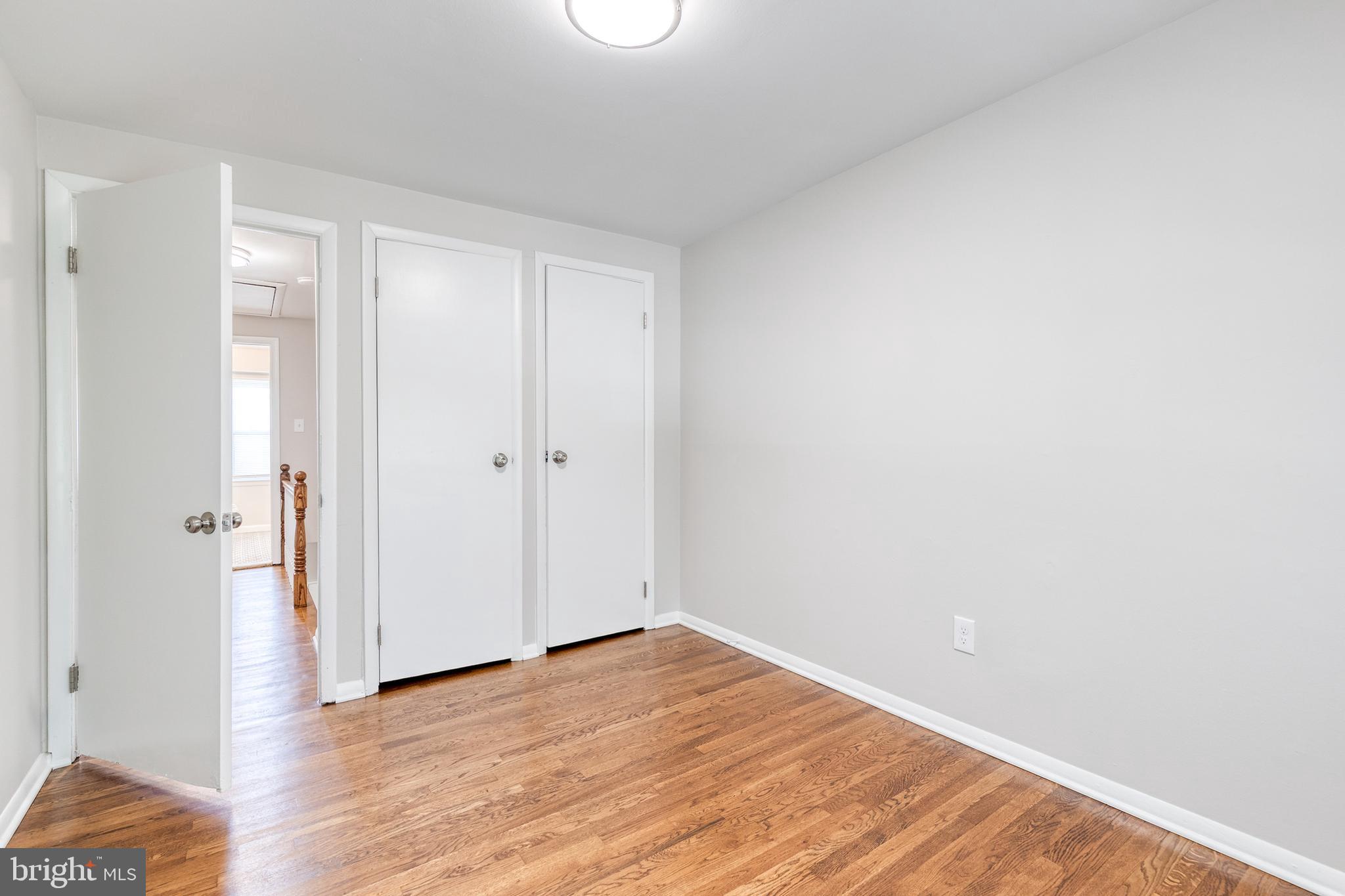 5649 Utrecht Road Baltimore, MD 21206 - Photo 27 of 42 a view of an empty room with wooden floor