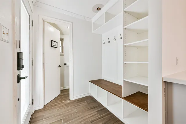 a hallway with wooden floor