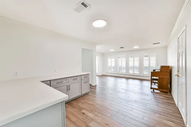 a view of a kitchen with a sink and a window