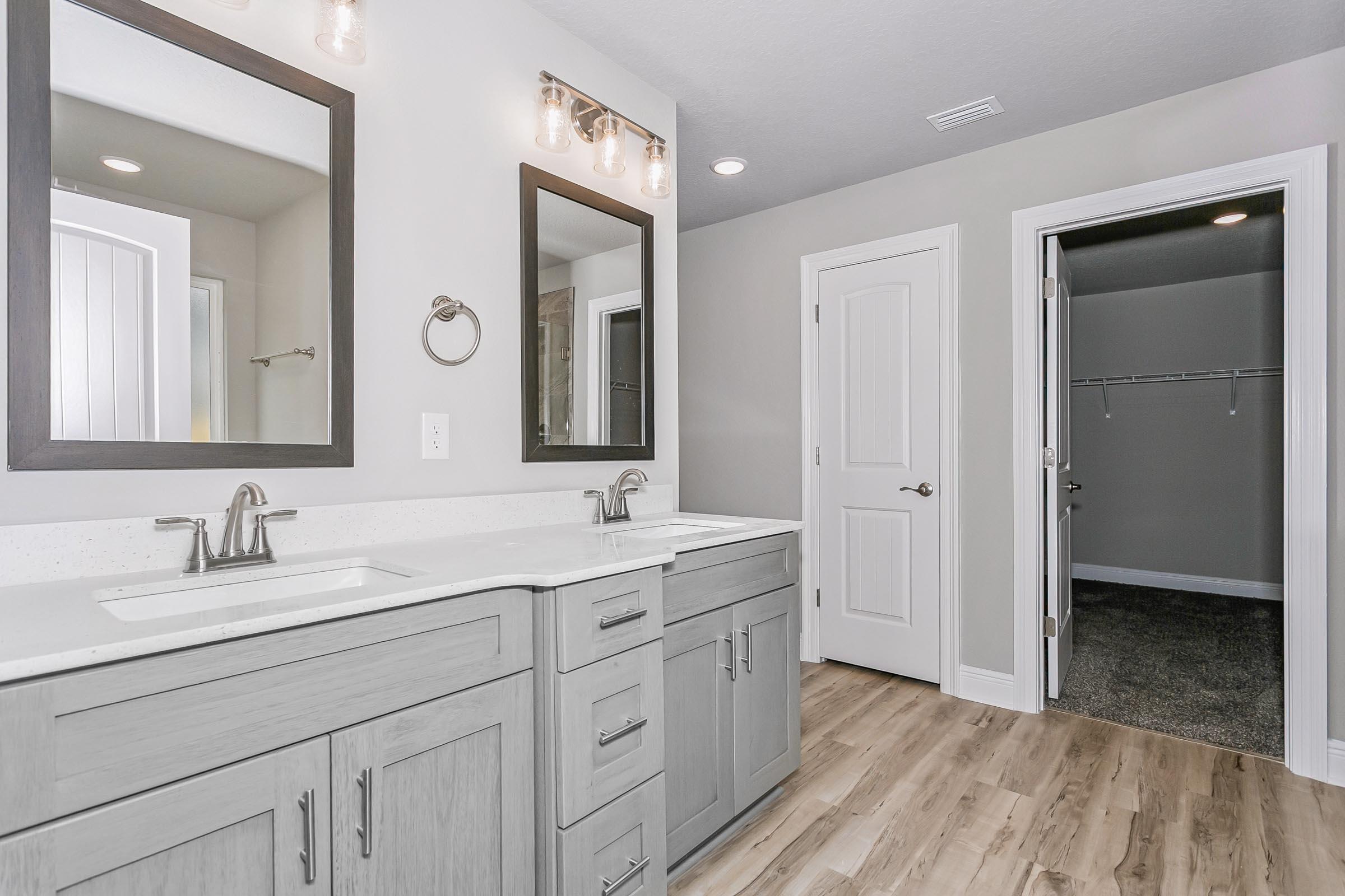 4823 Horace Lunsford Road Milton, FL 32570 - Photo 18 of 34 a spacious bathroom with a double vanity sink mirror and