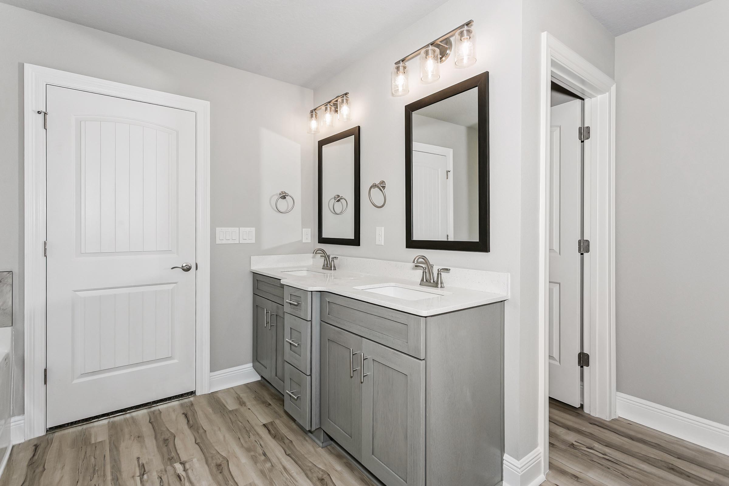4823 Horace Lunsford Road Milton, FL 32570 - Photo 21 of 34 a bathroom with 2 sink and a mirror