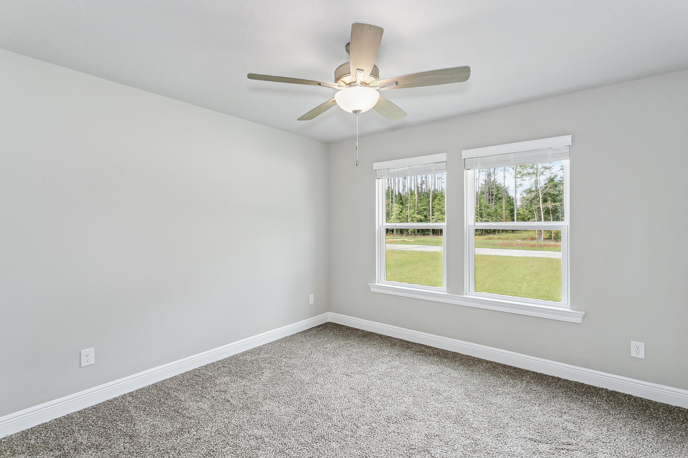 4823 Horace Lunsford Road Milton, FL 32570 - Photo 27 of 34 an empty room with a window and a fan