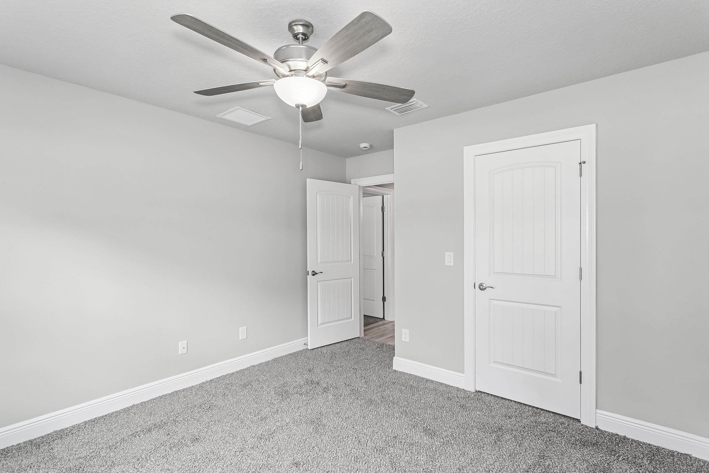 4823 Horace Lunsford Road Milton, FL 32570 - Photo 28 of 34 an empty room with a ceiling fan and a window