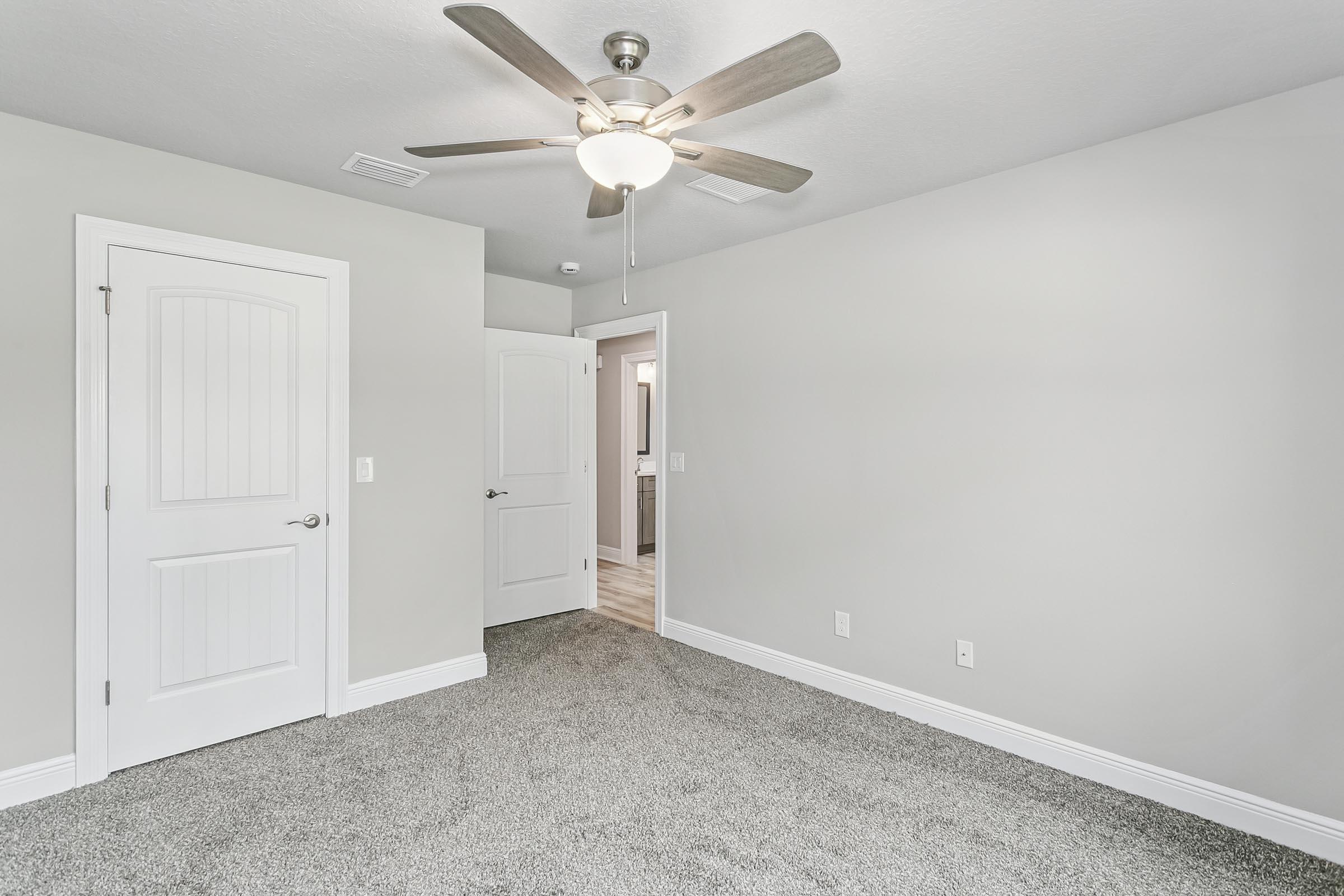 4823 Horace Lunsford Road Milton, FL 32570 - Photo 30 of 34 an empty room with a ceiling fan and a ceiling fan