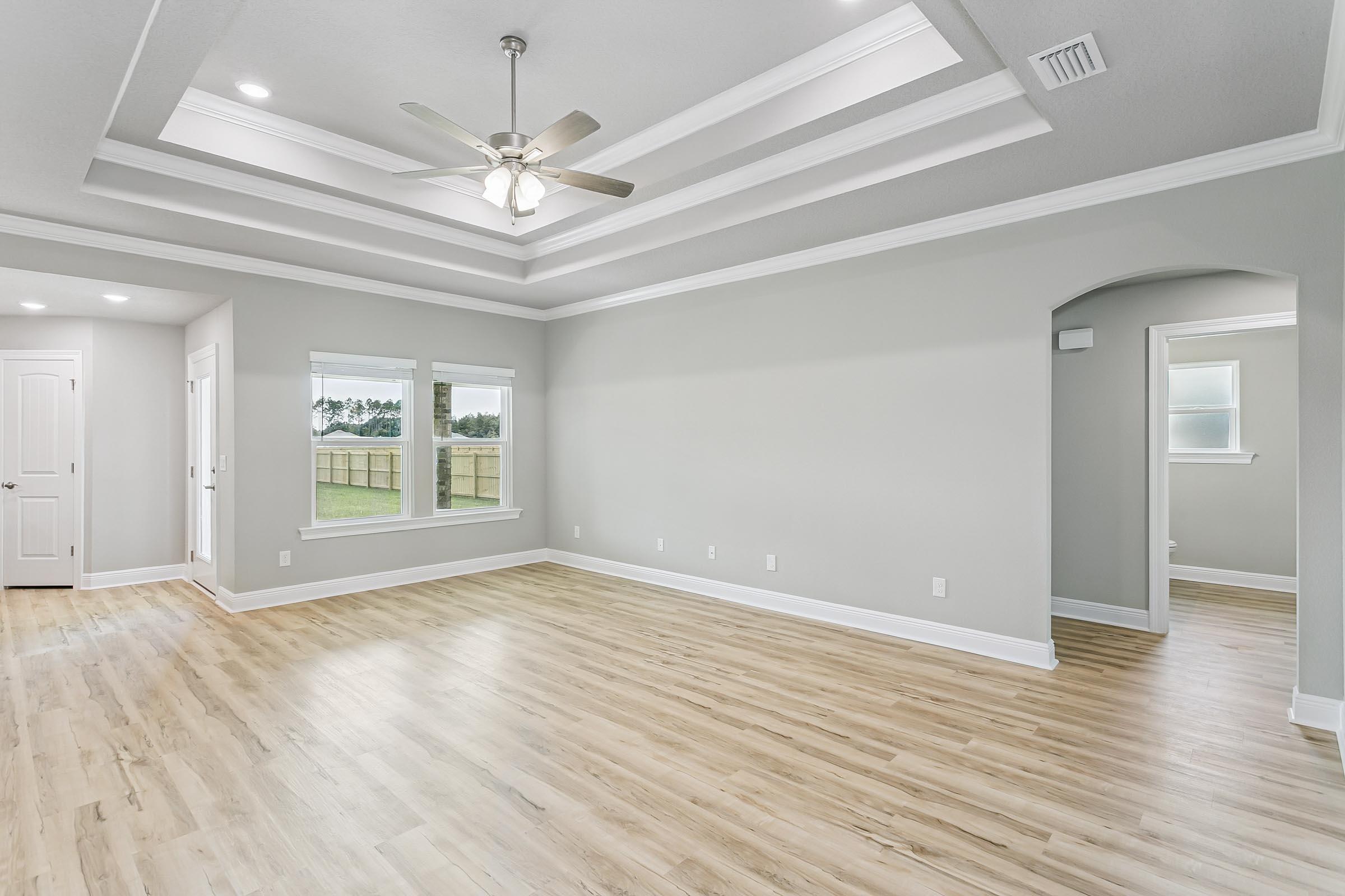 4823 Horace Lunsford Road Milton, FL 32570 - Photo 5 of 34 wooden floor in an empty room with a window