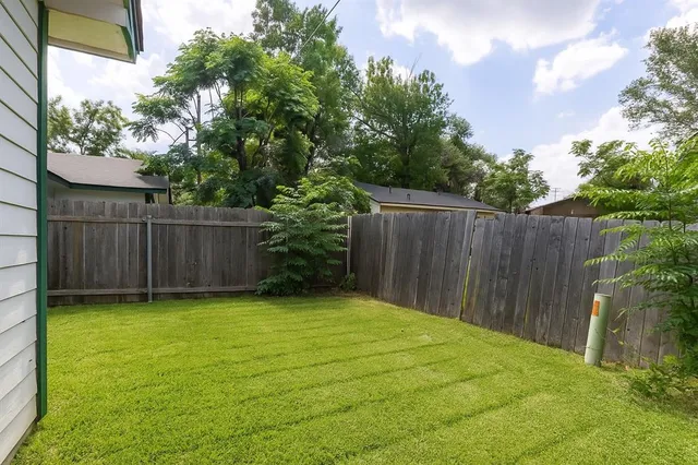 a view of a backyard of the house