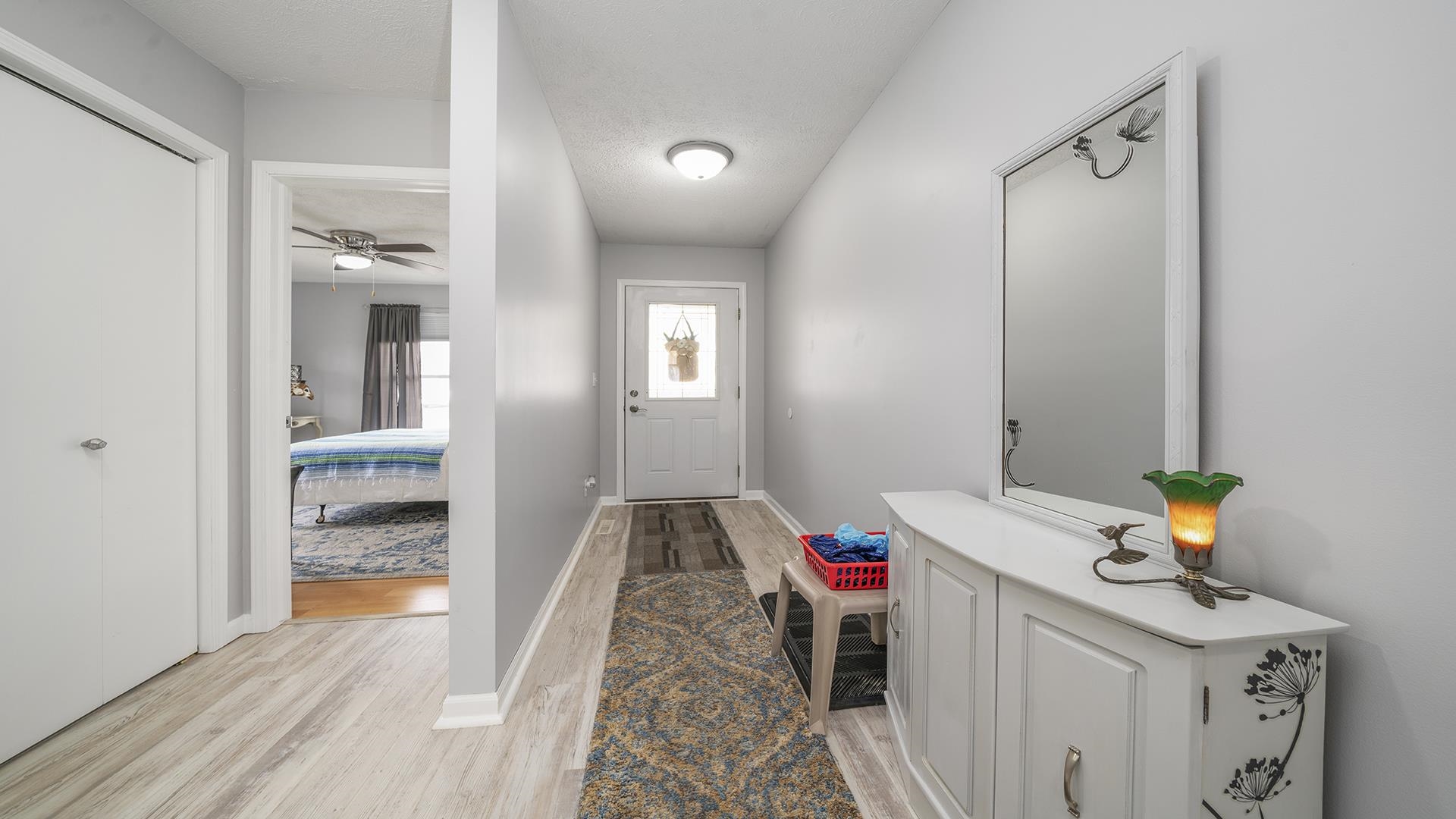 501 Pembroke Road Southwest Poplar Grove, IL 61065 - Photo 15 of 40 a hallway with a wooden floor dining table and chairs