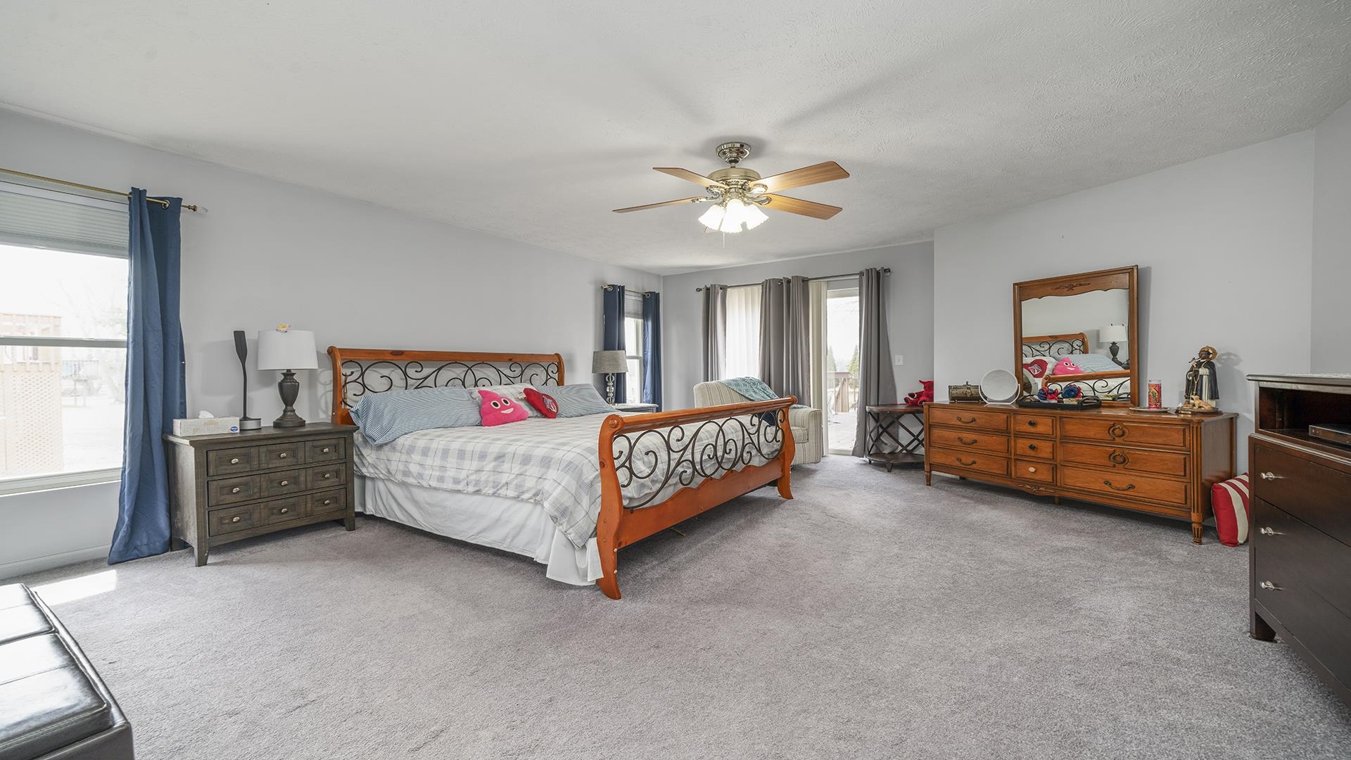 501 Pembroke Road Southwest Poplar Grove, IL 61065 - Photo 21 of 40 a bedroom with a bed and a chandelier