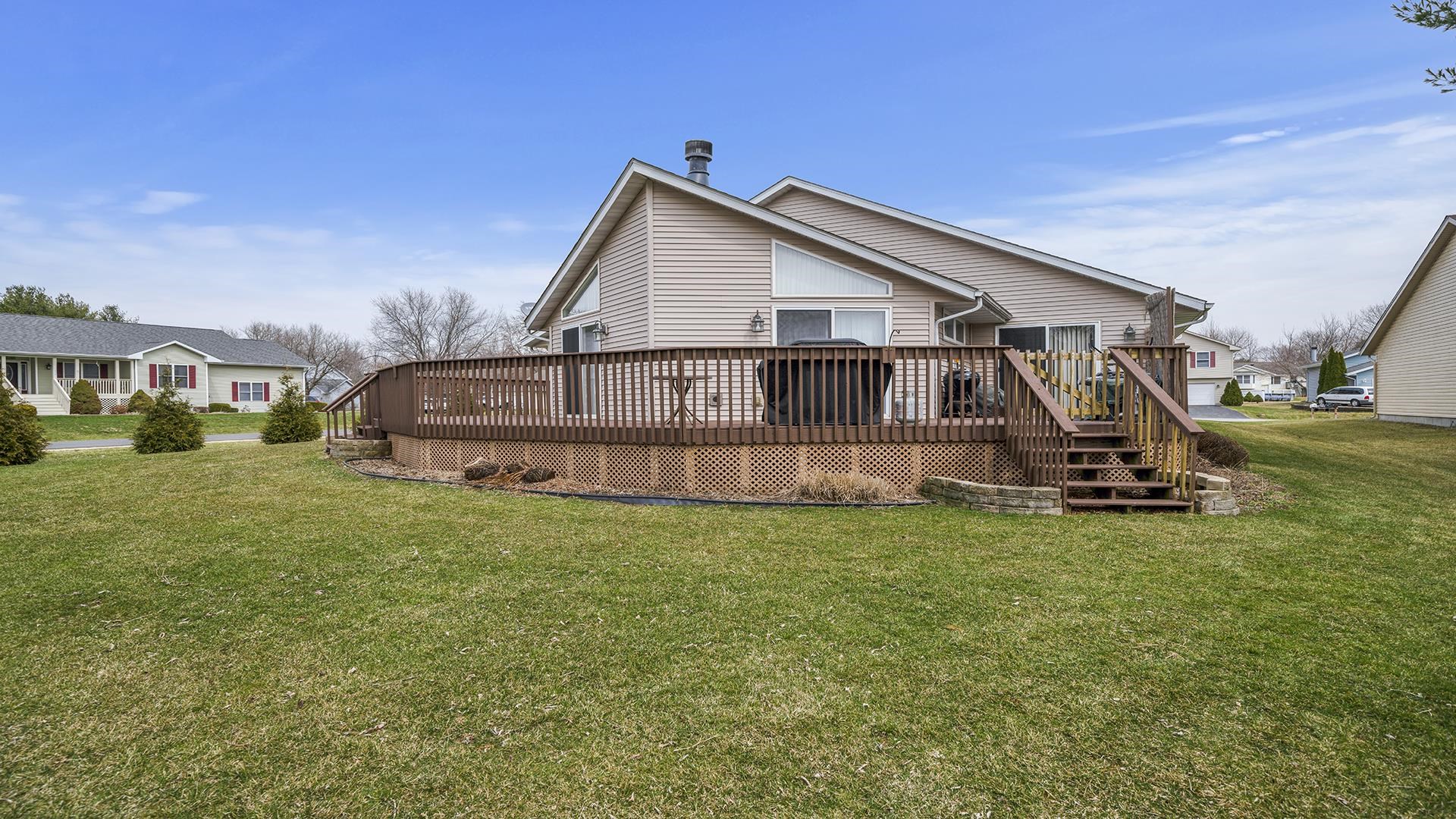501 Pembroke Road Southwest Poplar Grove, IL 61065 - Photo 34 of 40 a view of a house with a yard and sitting area