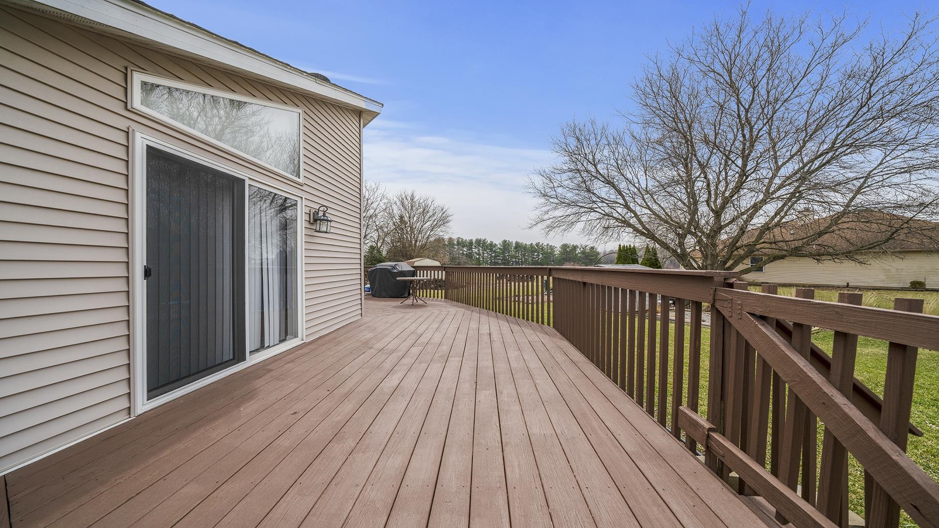 501 Pembroke Road Southwest Poplar Grove, IL 61065 - Photo 36 of 40 a view of deck with wooden floor and fence