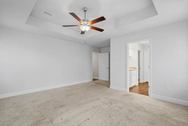 an empty room with a empty space and windows