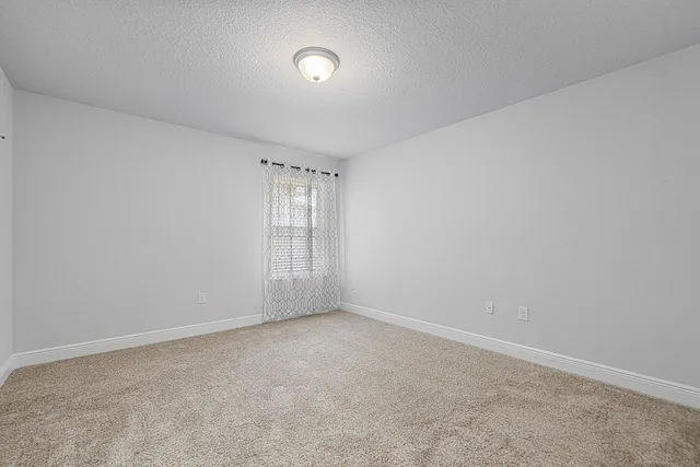 a kitchen with stainless steel appliances granite countertop a sink refrigerator and microwave