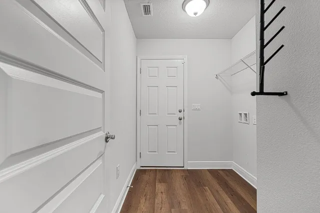 a view of room with window and hardwood floor