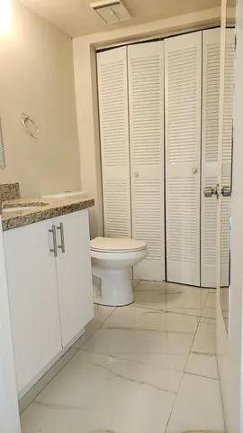 a bathroom with a shower and a toilet