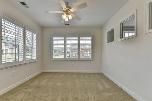 an aerial view of a house with garden space and street view