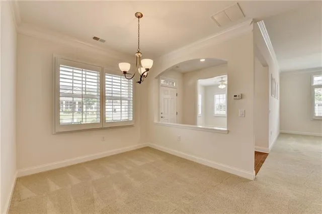a view of a kitchen with a sink stainless steel appliances and cabinets