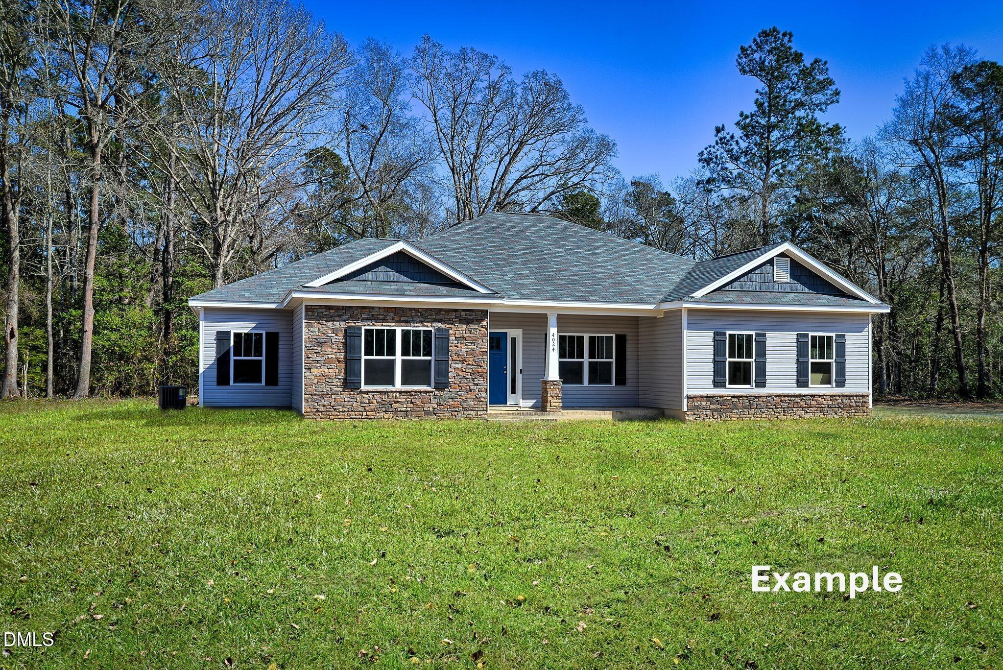 0 South Plank Road, Unit TRACK 2 Sanford, NC 27330 - Photo 2 of 39 a front view of a house with a garden