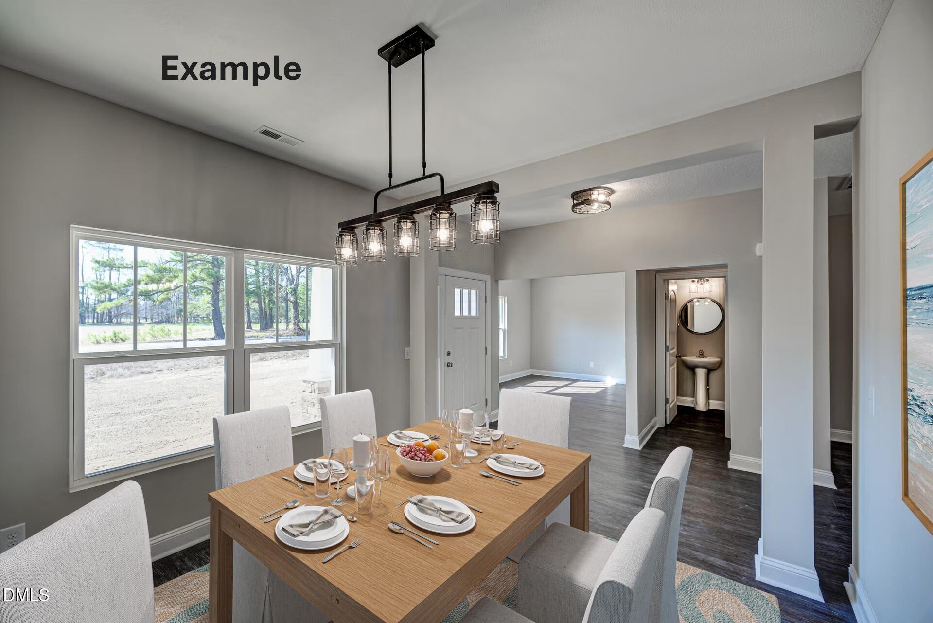 0 South Plank Road, Unit TRACK 2 Sanford, NC 27330 - Photo 5 of 39 a view of a dining room with furniture wooden floor and chandelier