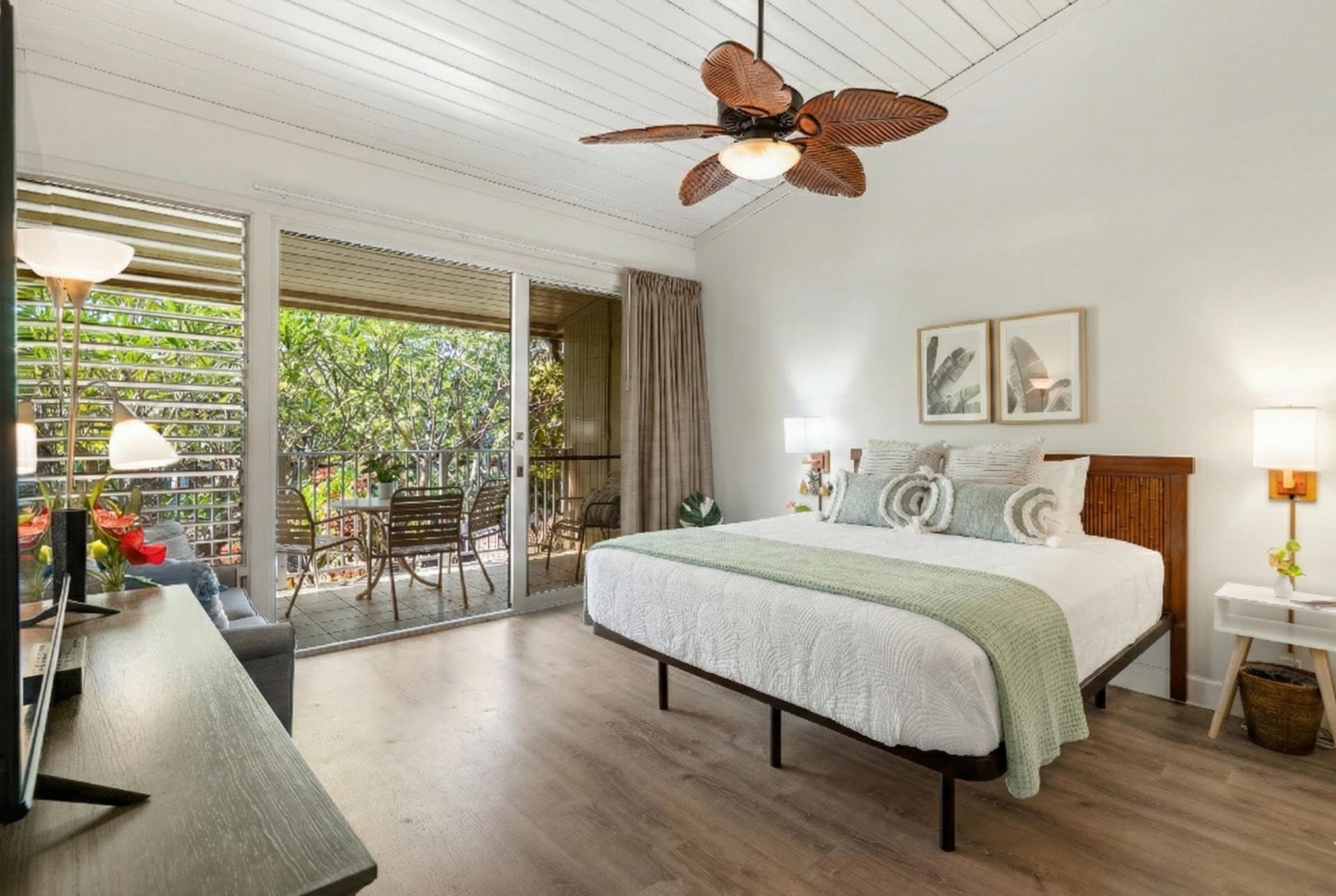 5315 Lower Honoapiilani Road, Unit D232 Lahaina, HI 96761 - Photo 12 of 31 a spacious bedroom with a large bed and a chandelier