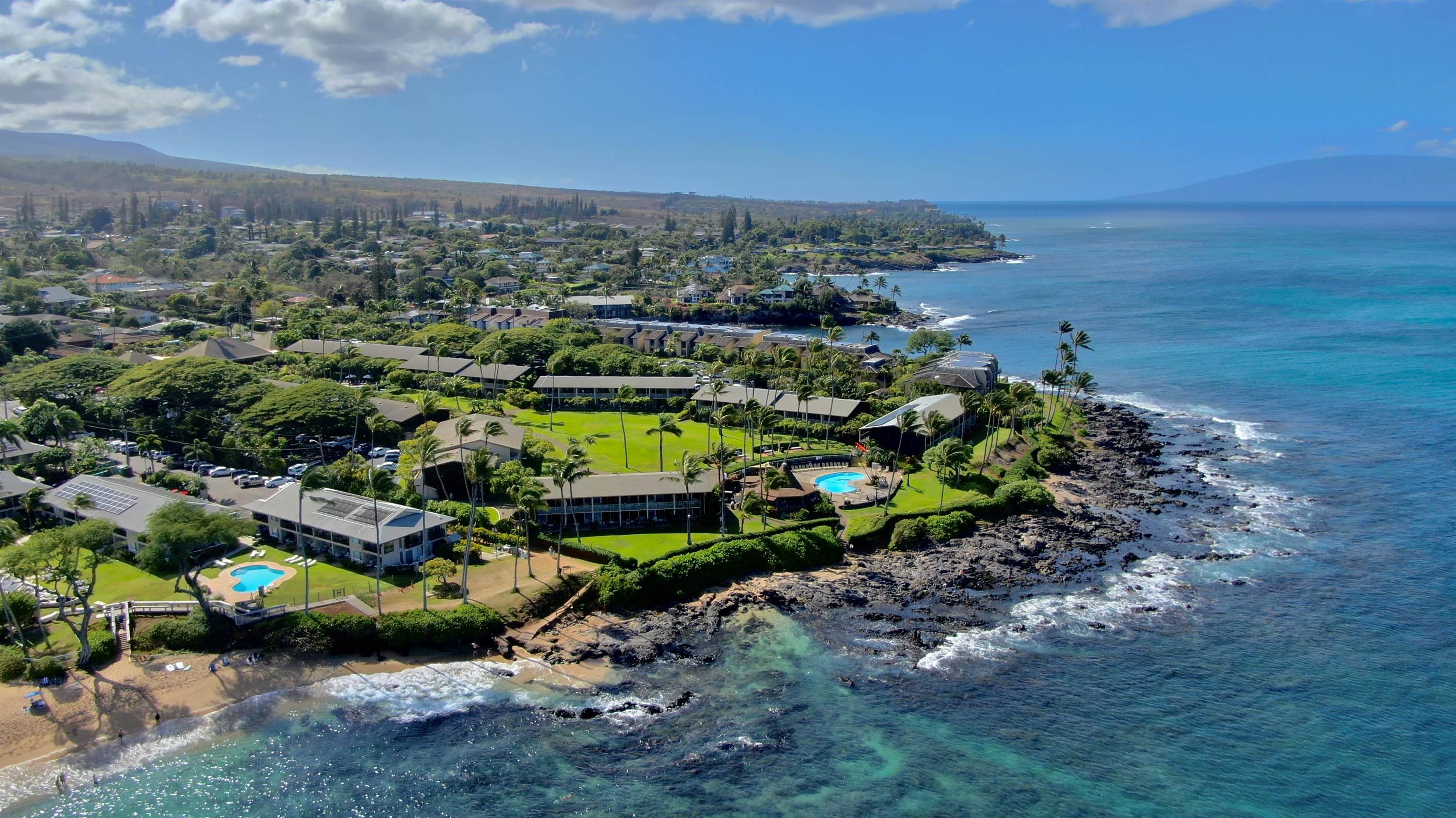 5315 Lower Honoapiilani Road, Unit D232 Lahaina, HI 96761 - Photo 19 of 31 a view of a garden with lawn chairs
