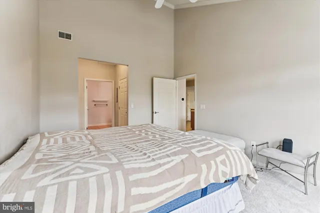 a bedroom with a bed and chair