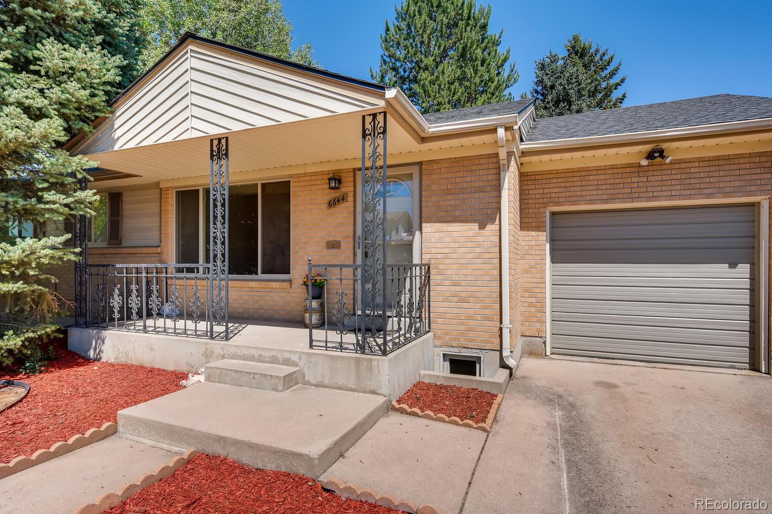 a view of house with a patio
