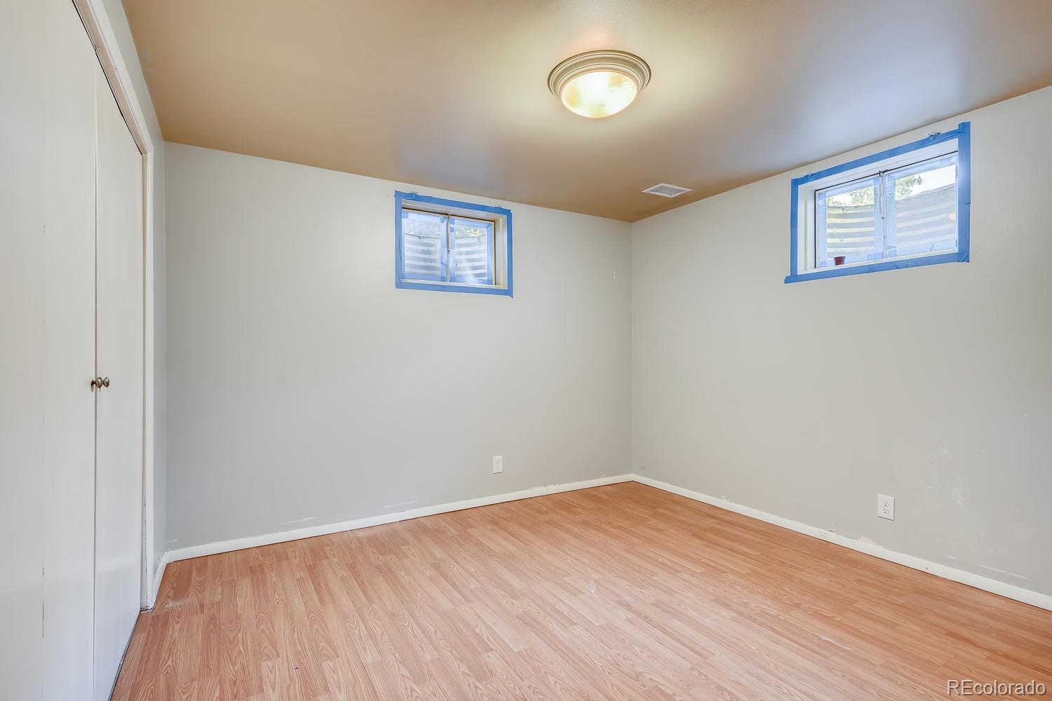 6644 South Race Circle East Centennial, CO 80121 - Photo 12 of 20 an empty room with wooden floor and windows