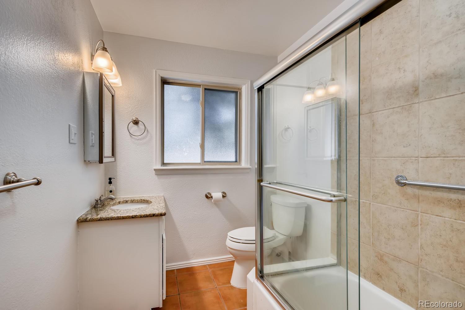 6644 South Race Circle East Centennial, CO 80121 - Photo 7 of 20 a bathroom with a sink and a mirror
