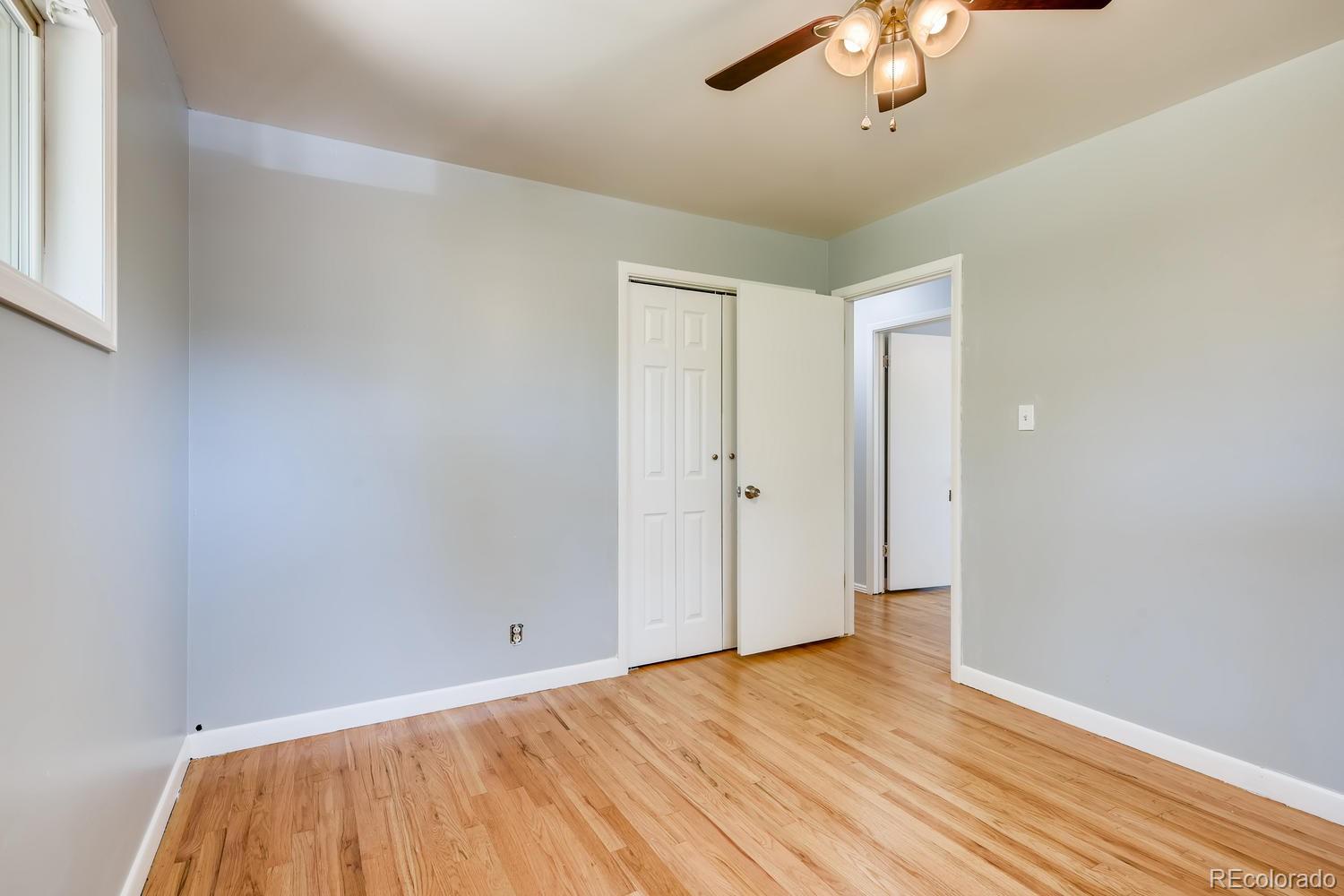 6644 South Race Circle East Centennial, CO 80121 - Photo 8 of 20 a view of an empty room with wooden floor