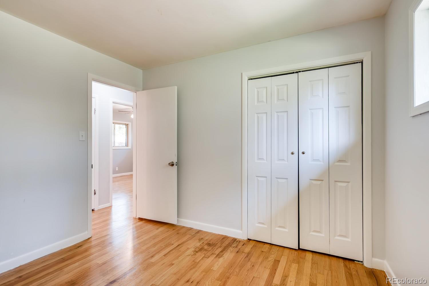 6644 South Race Circle East Centennial, CO 80121 - Photo 9 of 20 a view of an empty room and wooden floor
