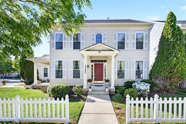 a view of a house with a yard and plants