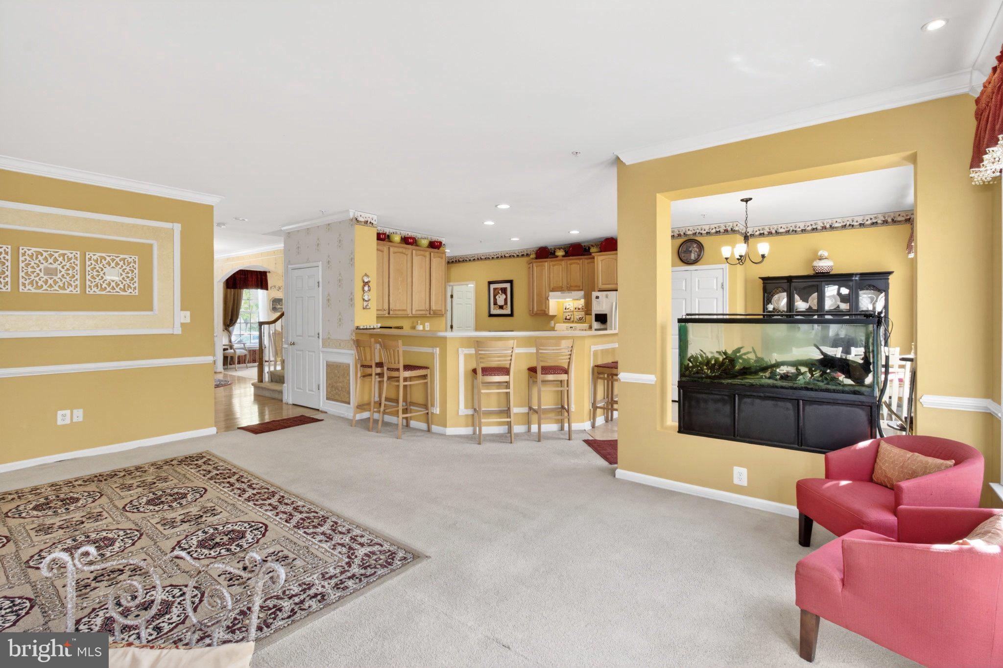14305 Lightfoot Street Accokeek, MD 20607 - Photo 23 of 66 a spacious bedroom with a bed and a couch