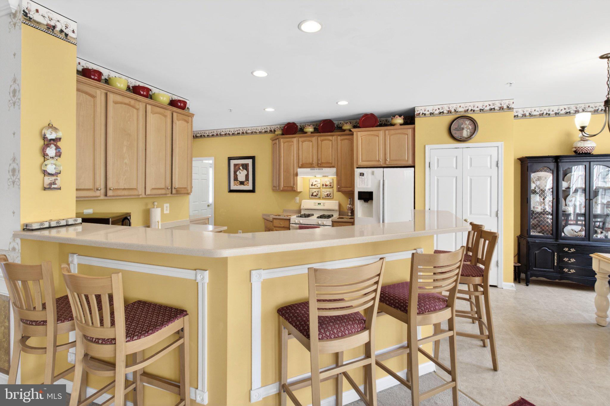 14305 Lightfoot Street Accokeek, MD 20607 - Photo 25 of 66 a kitchen with a table and chairs in it