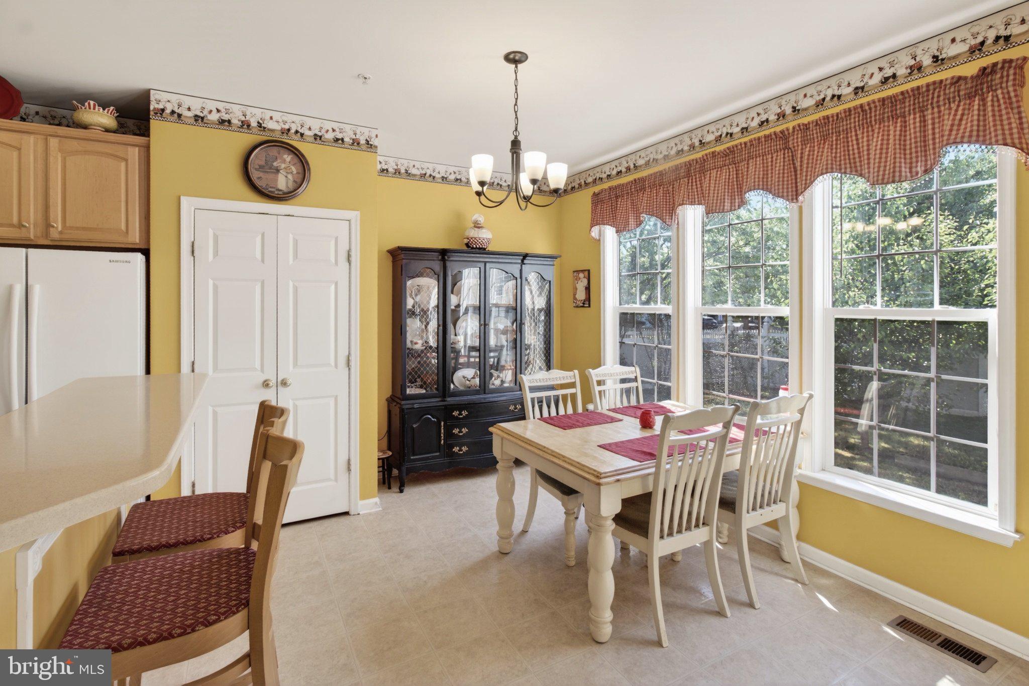 14305 Lightfoot Street Accokeek, MD 20607 - Photo 26 of 66 a dining room with furniture window wooden floor and front door