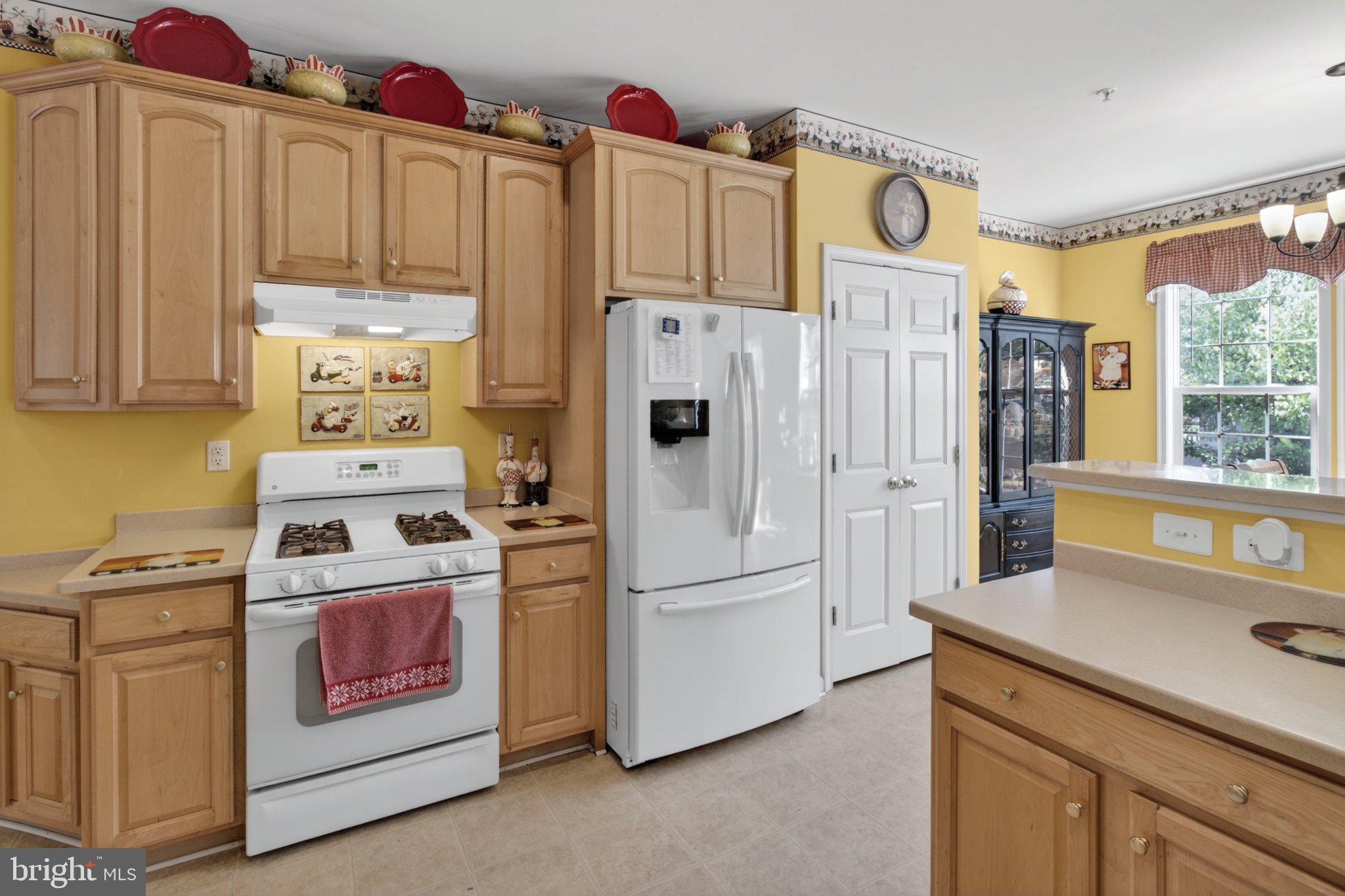 14305 Lightfoot Street Accokeek, MD 20607 - Photo 28 of 66 Sunny kitchen with warm wood tones.