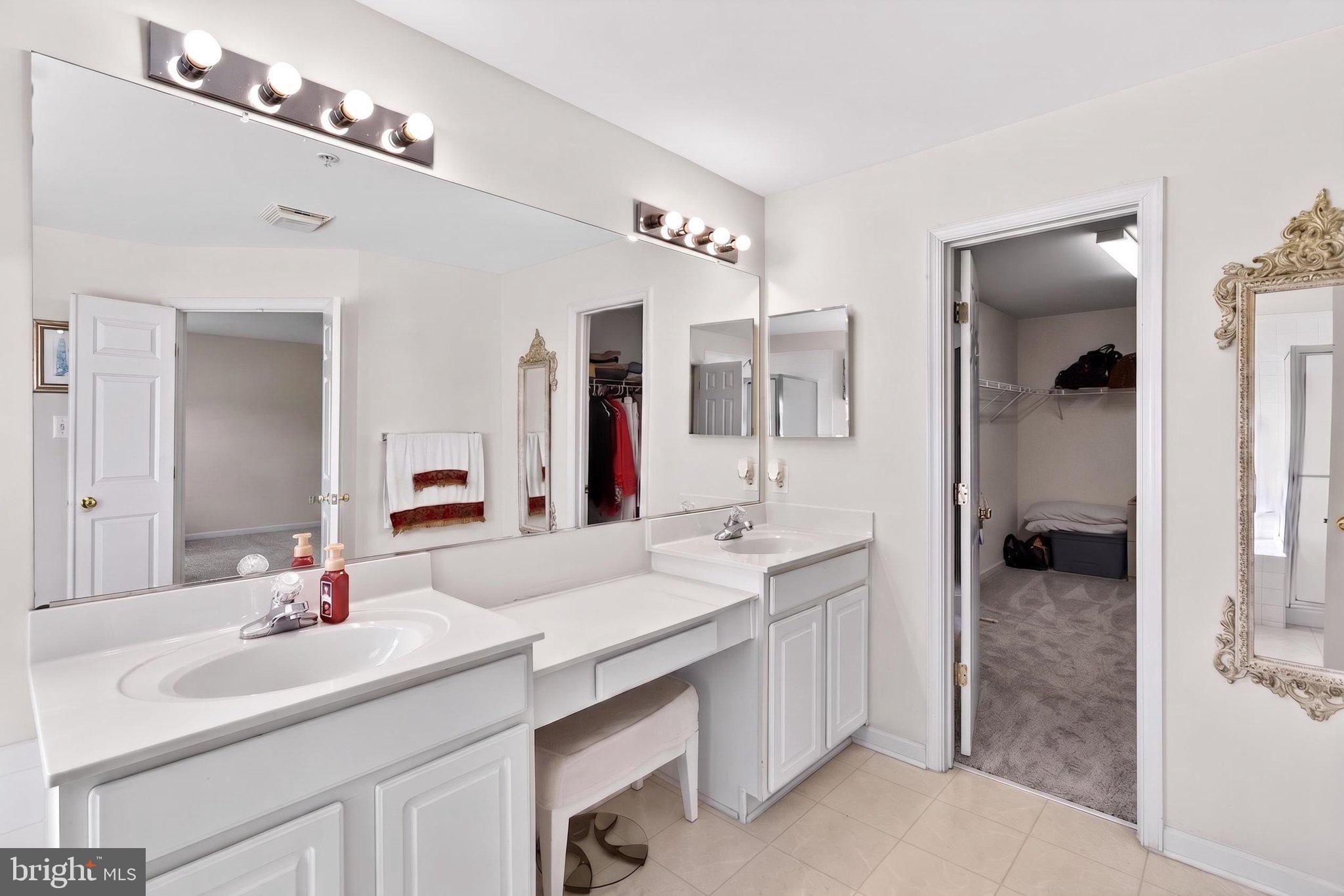 14305 Lightfoot Street Accokeek, MD 20607 - Photo 39 of 66 a bathroom with a sink double vanity and a mirror