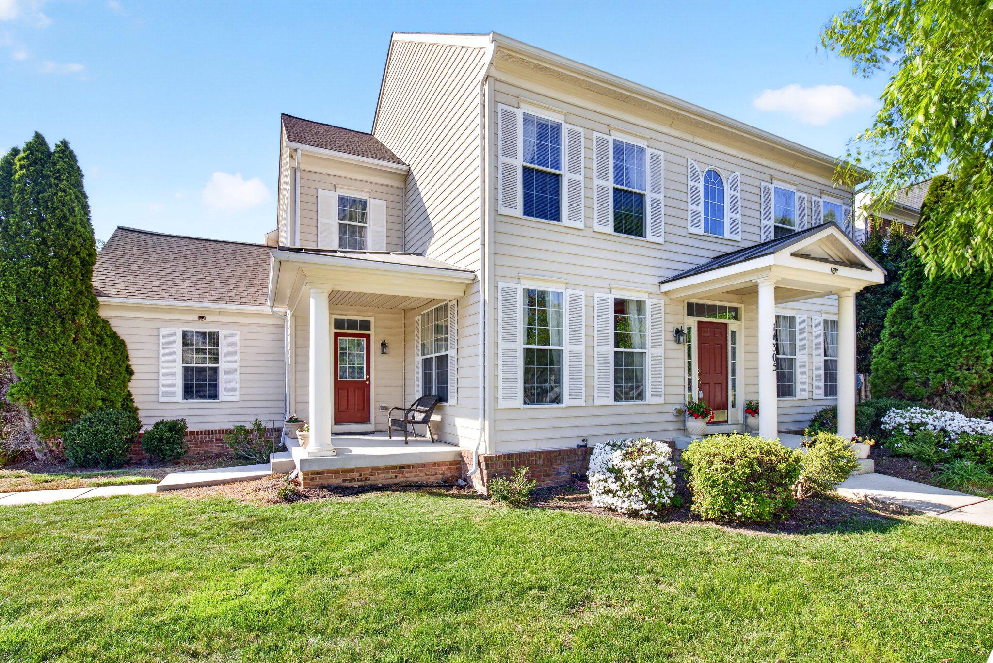 14305 Lightfoot Street Accokeek, MD 20607 - Photo 4 of 66 front view of a brick house with a yard