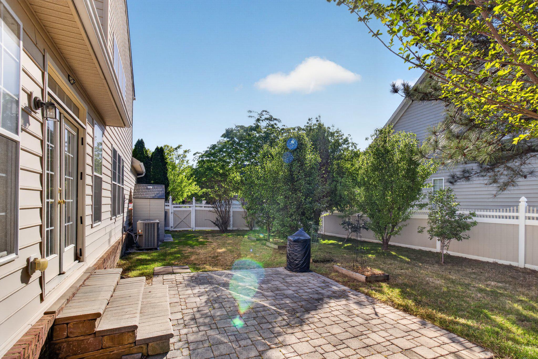 14305 Lightfoot Street Accokeek, MD 20607 - Photo 58 of 66 a view of a street with potted plants