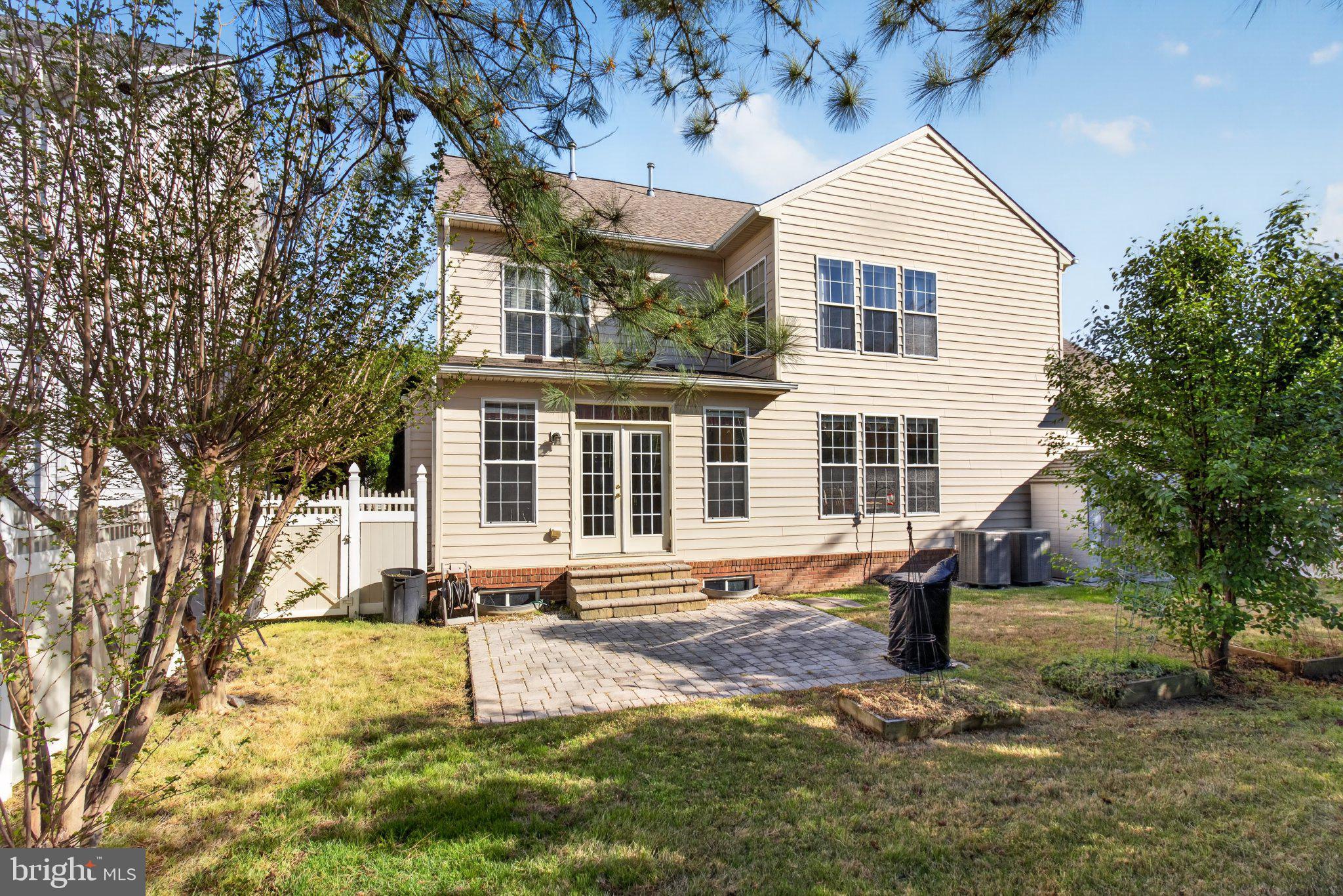 14305 Lightfoot Street Accokeek, MD 20607 - Photo 59 of 66 a front view of a house with a yard