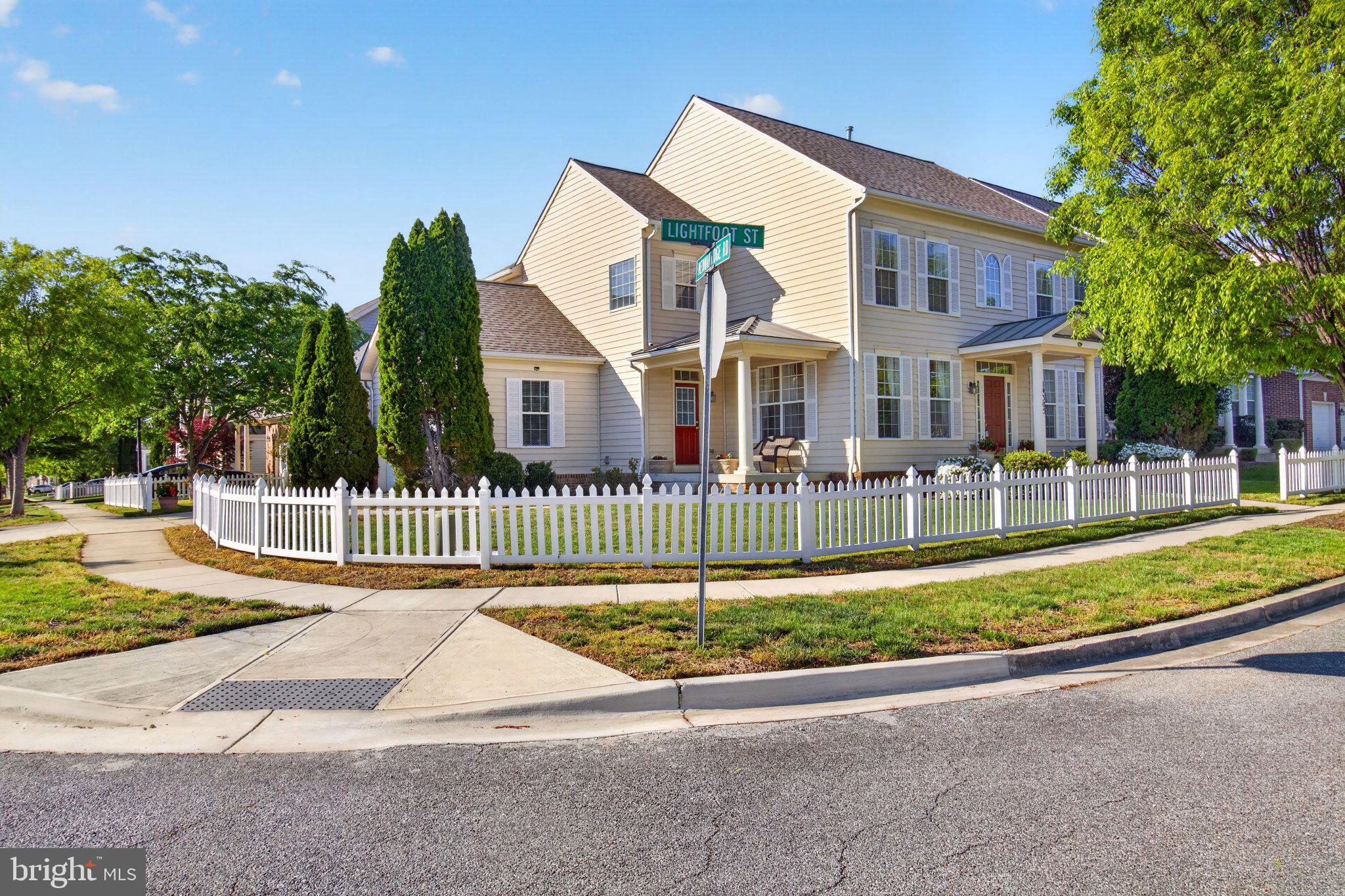 14305 Lightfoot Street Accokeek, MD 20607 - Photo 7 of 66 a front view of a house with a yard