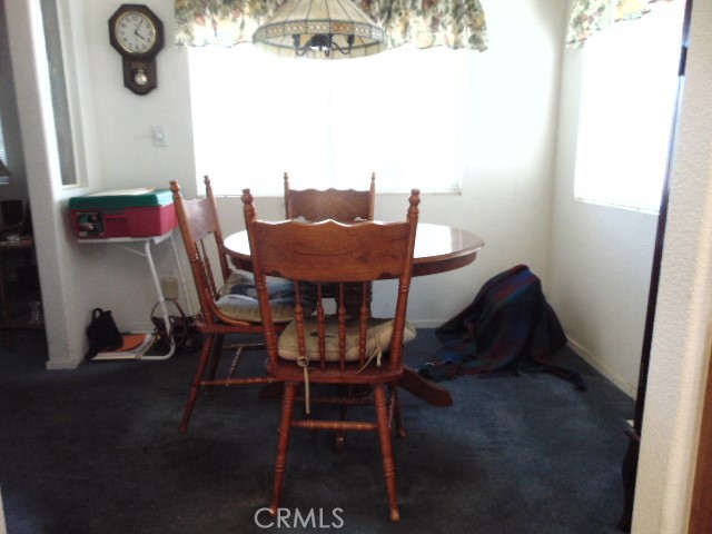 3835 Gardiner Ferry Road, Unit 62 Corning, CA 96021 - Photo 13 of 34 a view of a dining room with furniture and a chandelier