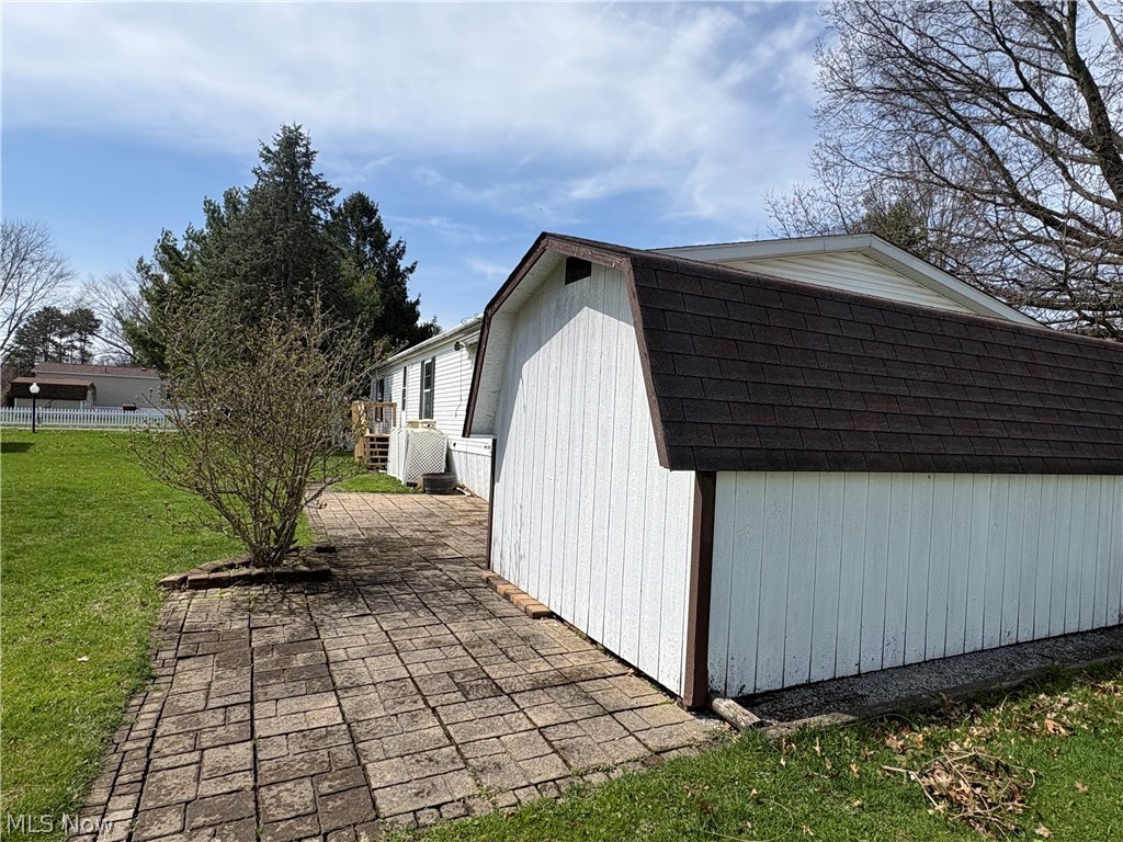 5852 Cleveland Road, Unit 22 Wooster, OH 44691 - Photo 6 of 35 From east end; shed and patio.