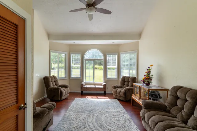 a living room with furniture and a large window