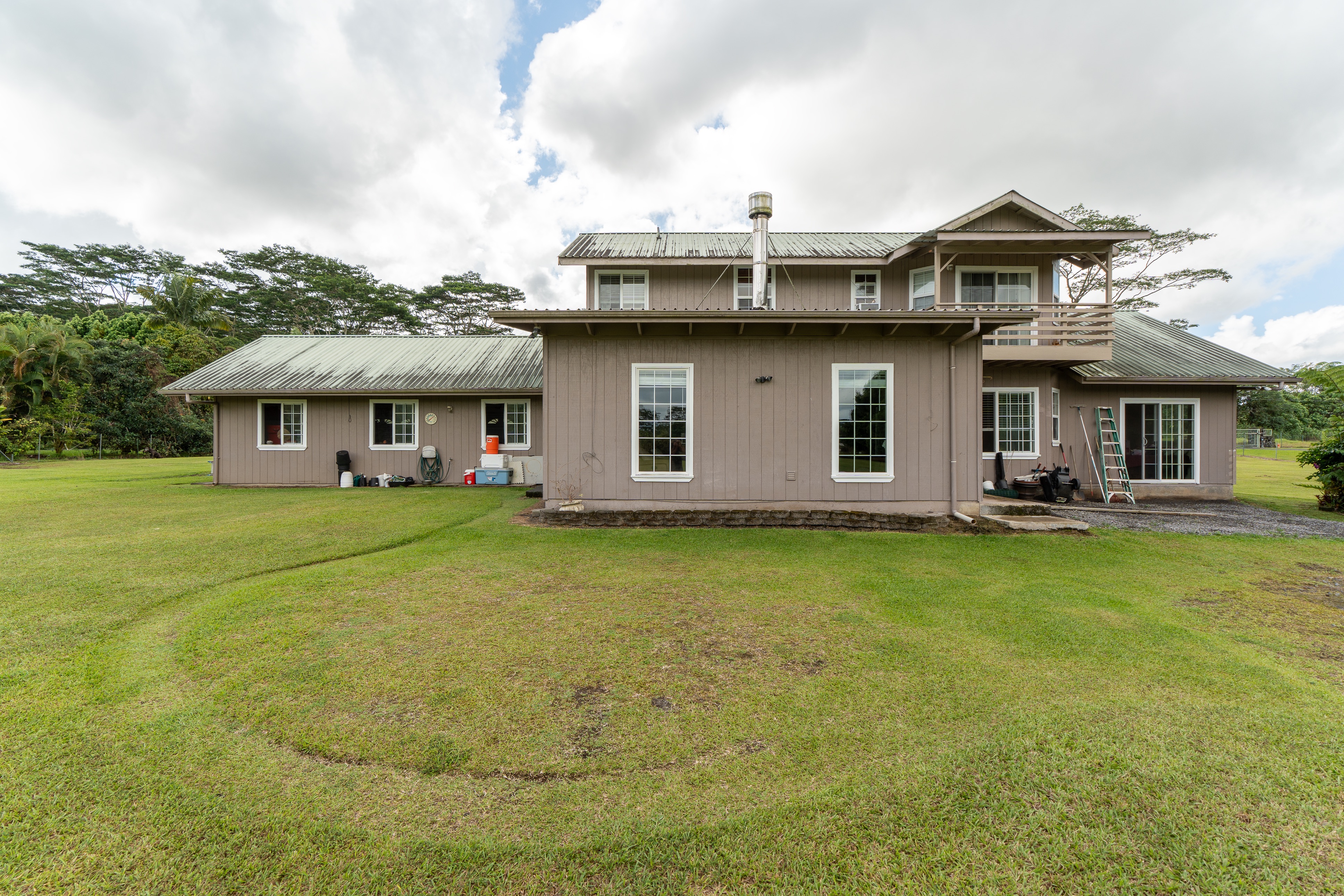 17-4044 South Road Keaau, HI 96749 - Photo 3 of 28 a front view of a house with a garden