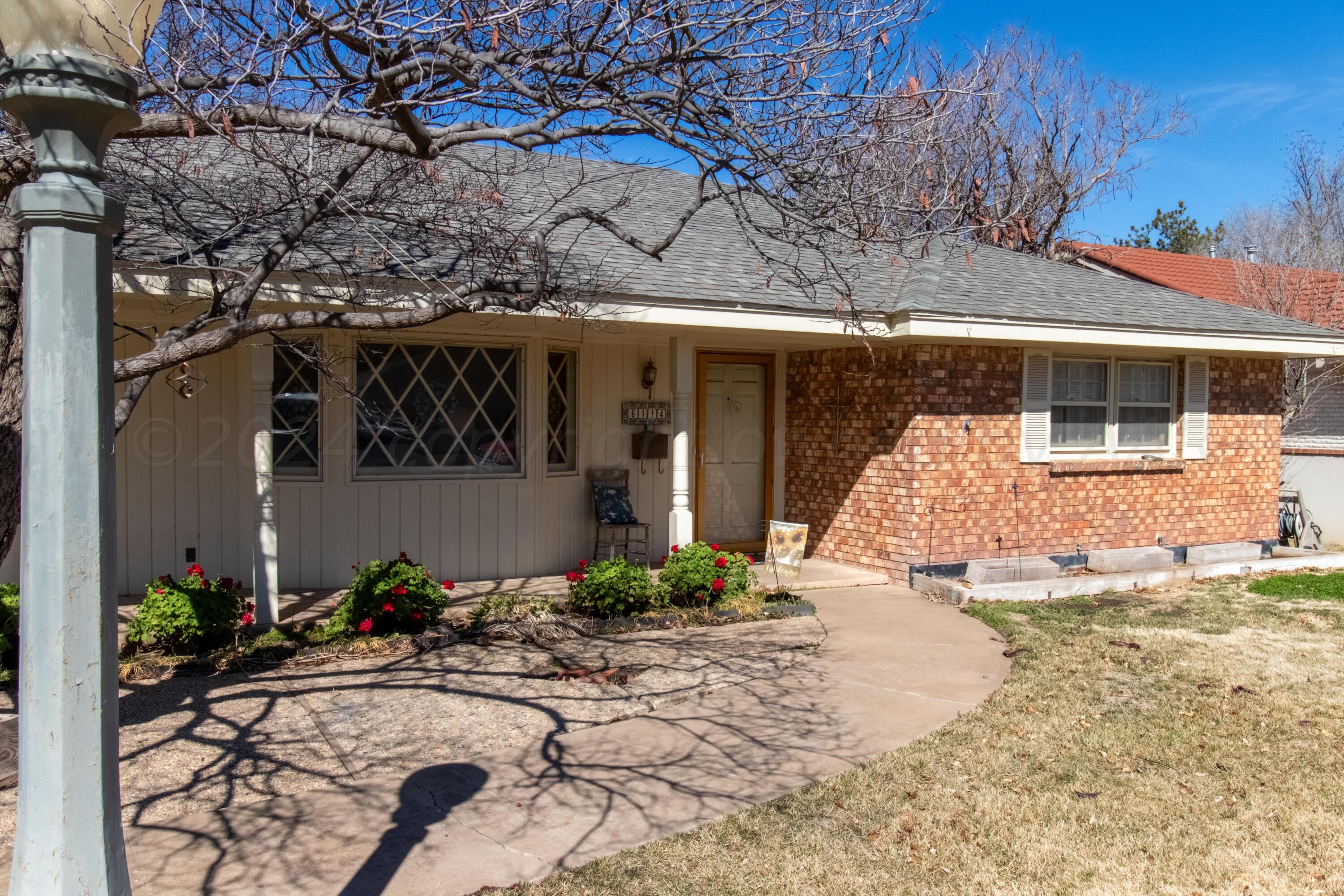 6114 Gainsborough Road Amarillo, TX 79106 - Photo 1 of 20 a front view of a house with a yard