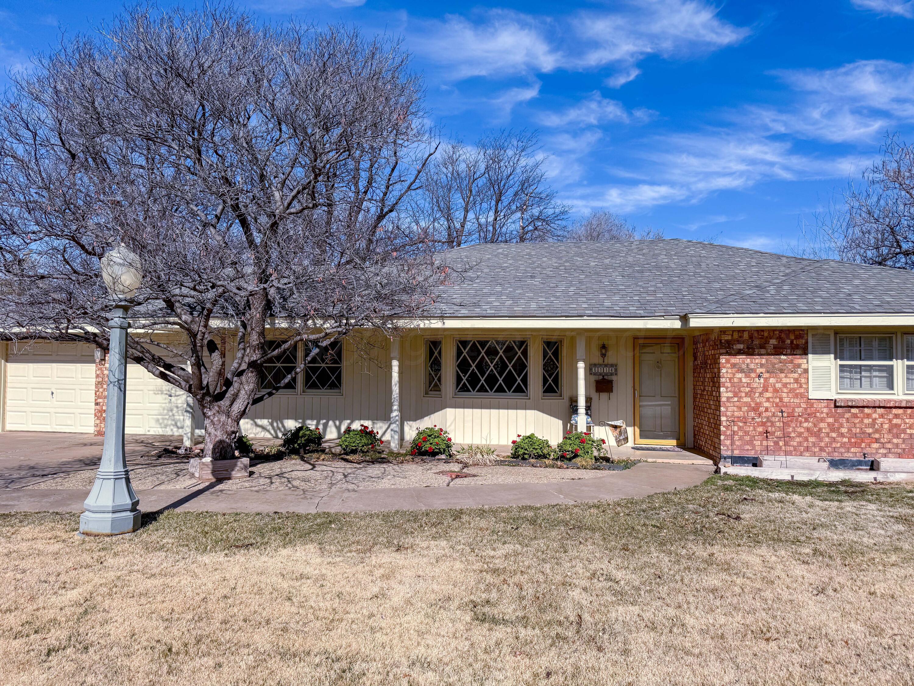 6114 Gainsborough Road Amarillo, TX 79106 - Photo 2 of 20 a view of a house with a yard